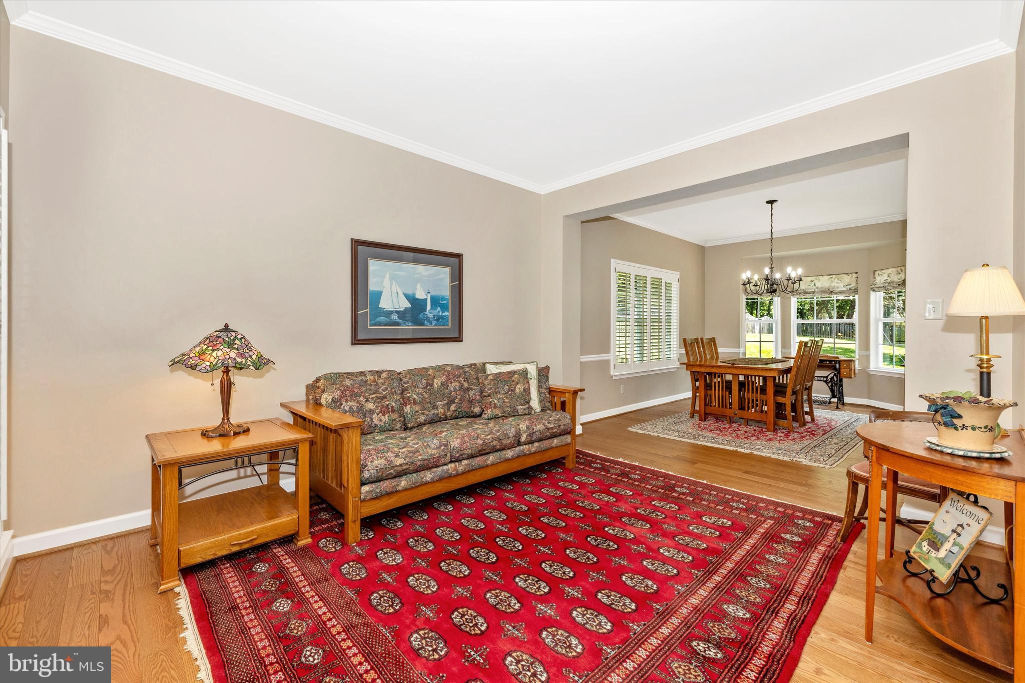 6341 Claridge Drive North Frederick, MD 21701 - Photo 5 of 54 a living room with furniture a rug and a table