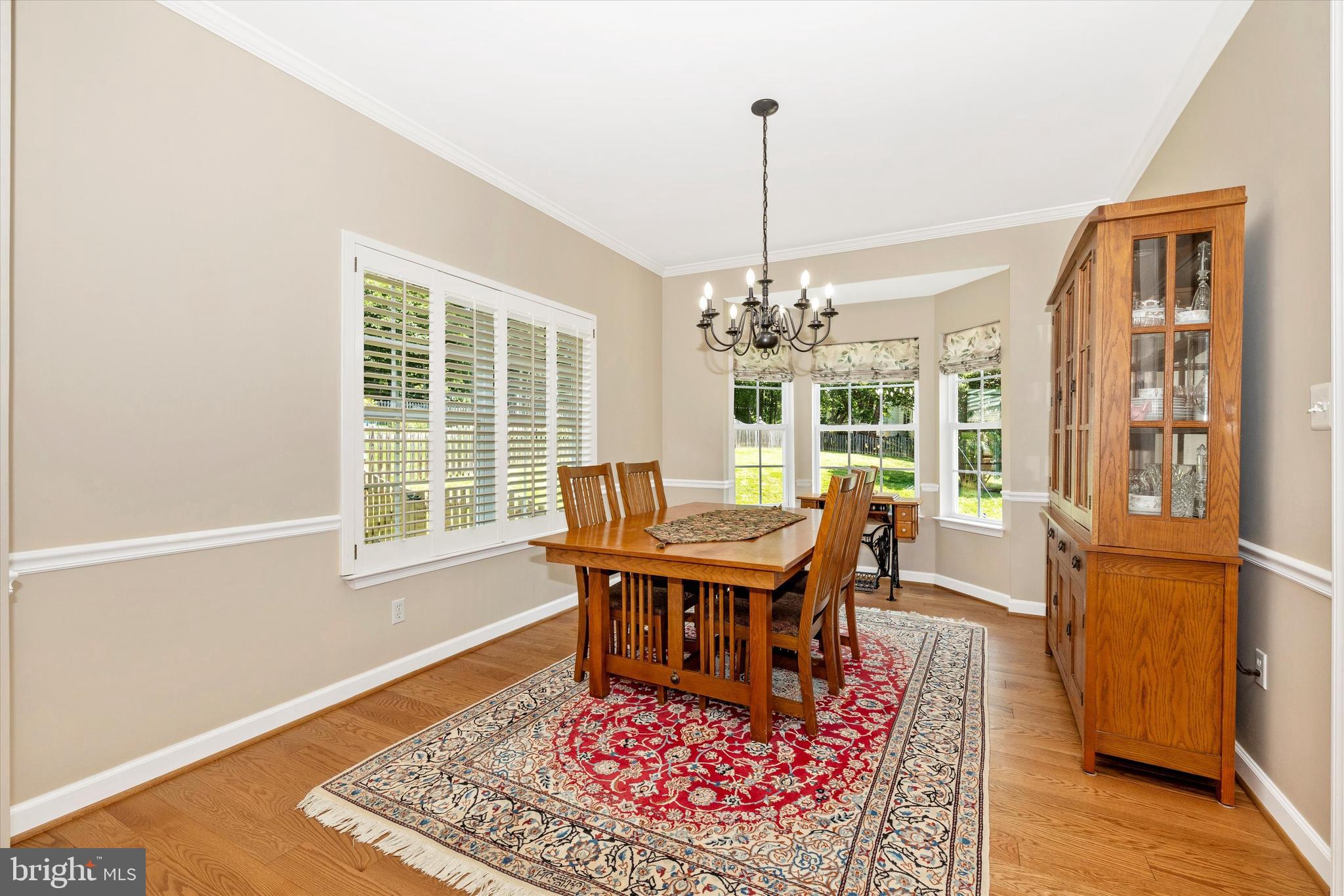 6341 Claridge Drive North Frederick, MD 21701 - Photo 7 of 54 a view of a dining room with furniture window and wooden floor