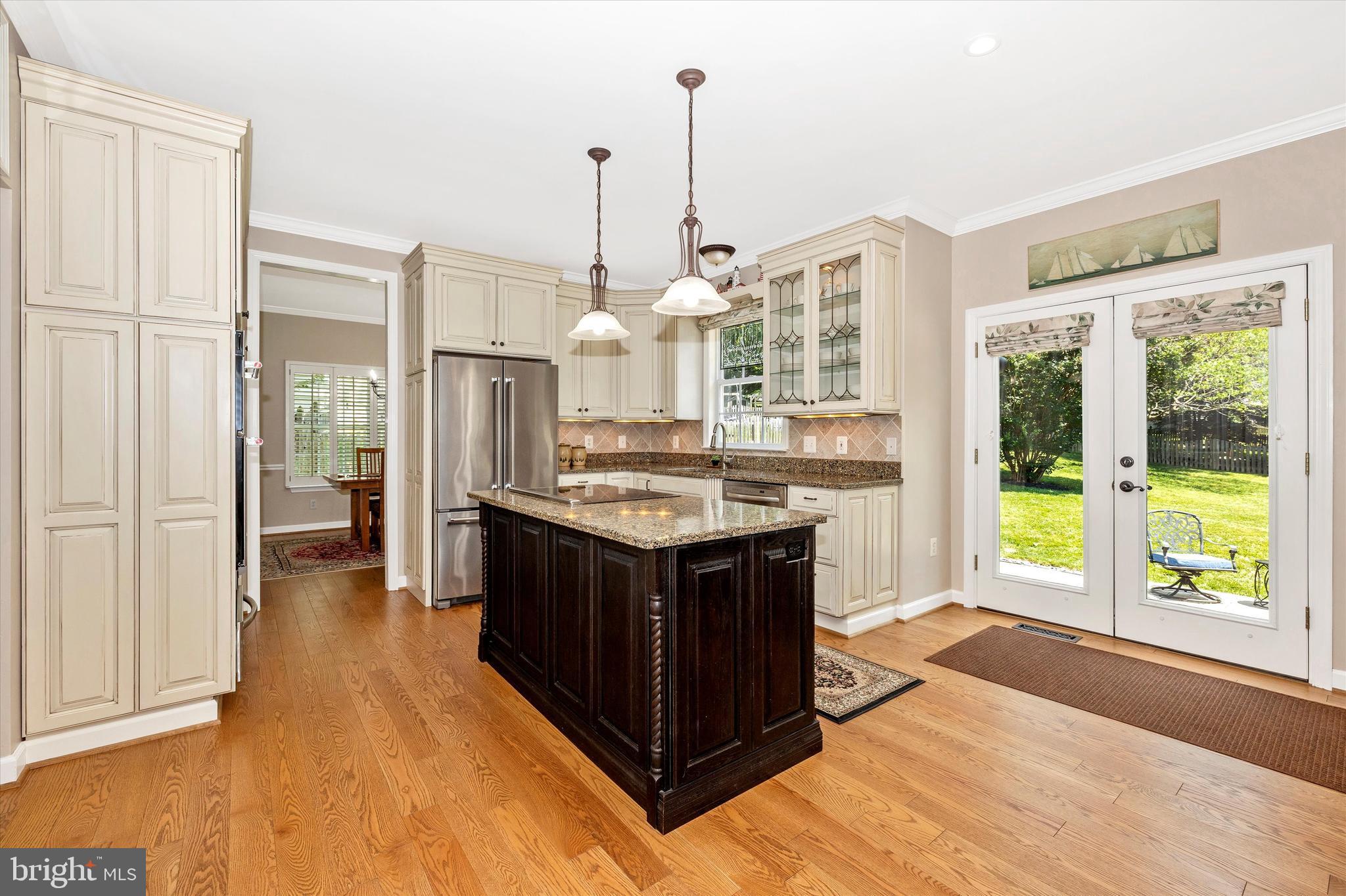 6341 Claridge Drive North Frederick, MD 21701 - Photo 8 of 54 a kitchen with a sink and a stove next to a window
