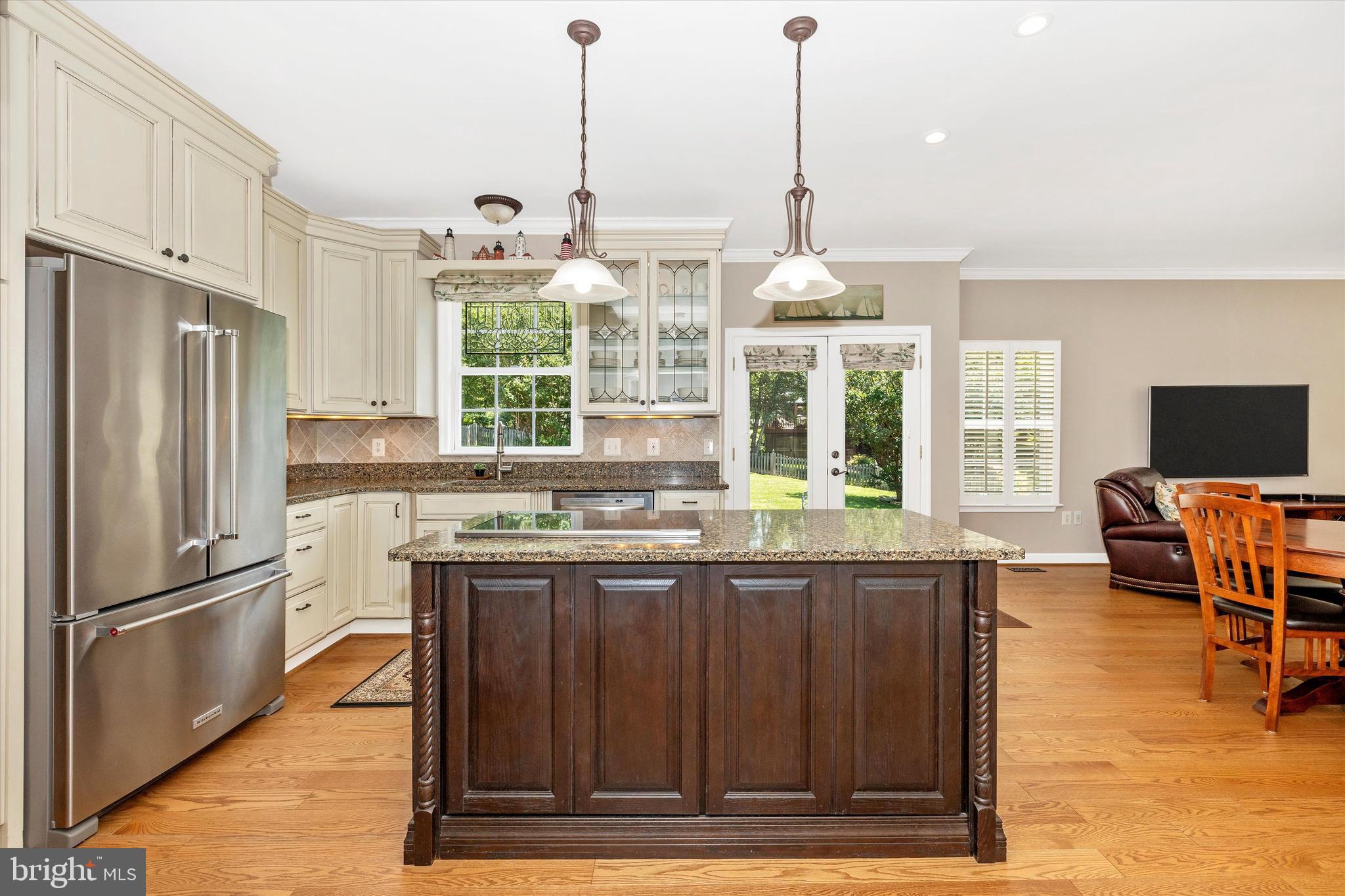 6341 Claridge Drive North Frederick, MD 21701 - Photo 10 of 54 a kitchen with stainless steel appliances granite countertop a stove and a refrigerator