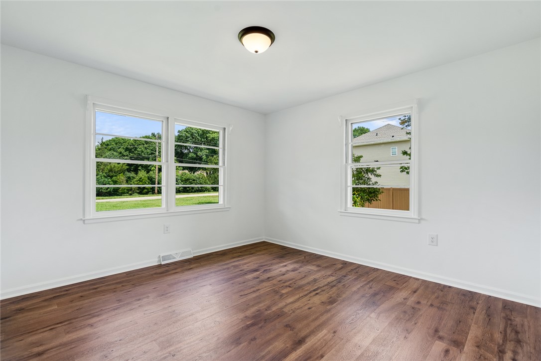 300 Vandiver Road Anderson, SC 29621 - Photo 19 of 30 Natural light floods this inviting room with rich, warm flooring, perfect for a cozy retreat.