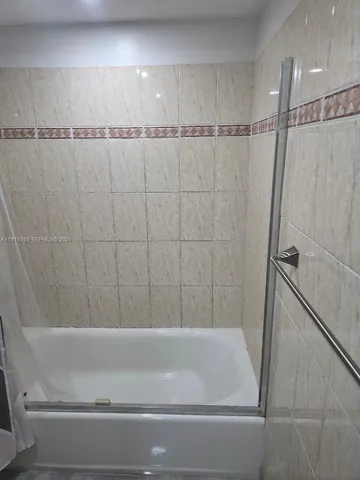 a bathroom with a bathtub