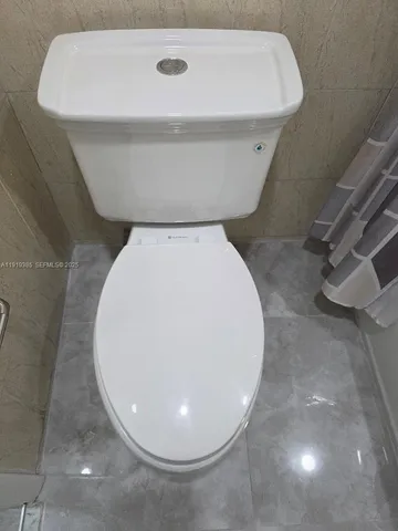 a bathroom with a toilet and a sink