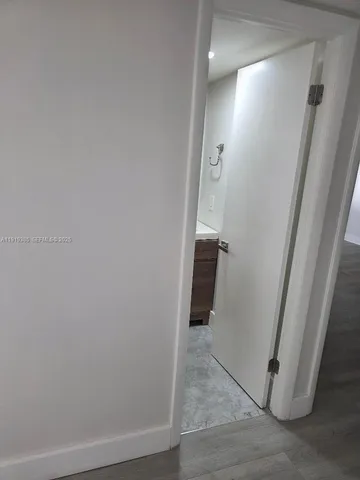 an empty room with wooden floor