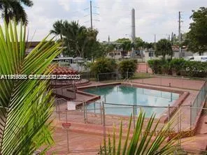 a view of a swimming pool with a patio