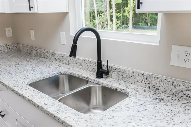 a kitchen with a sink and a window