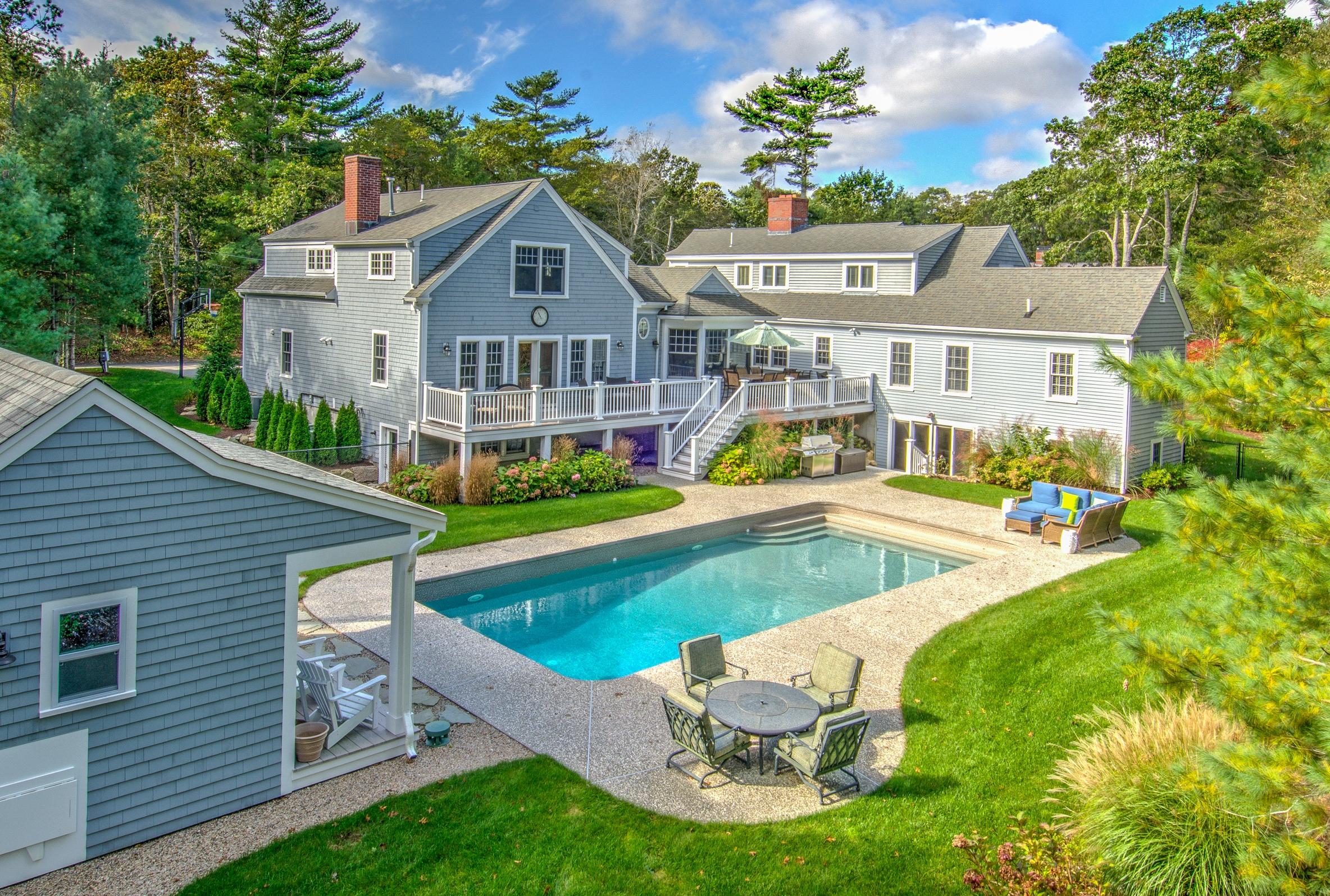 a view of house with a swimming pool outdoor seating and yard