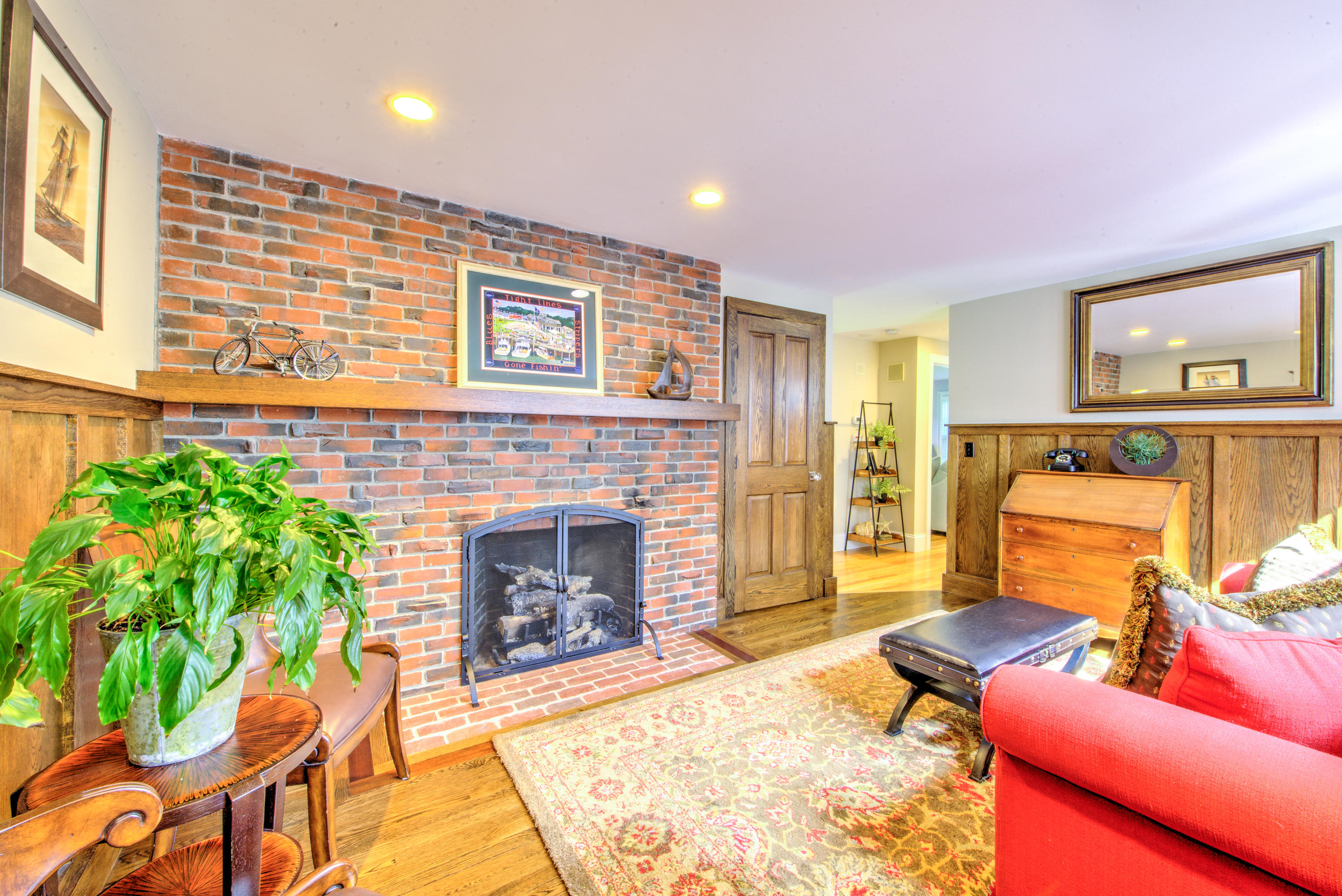 4 Hill Creek Road Centerville, MA 02632 - Photo 17 of 27 a living room with furniture and a fireplace