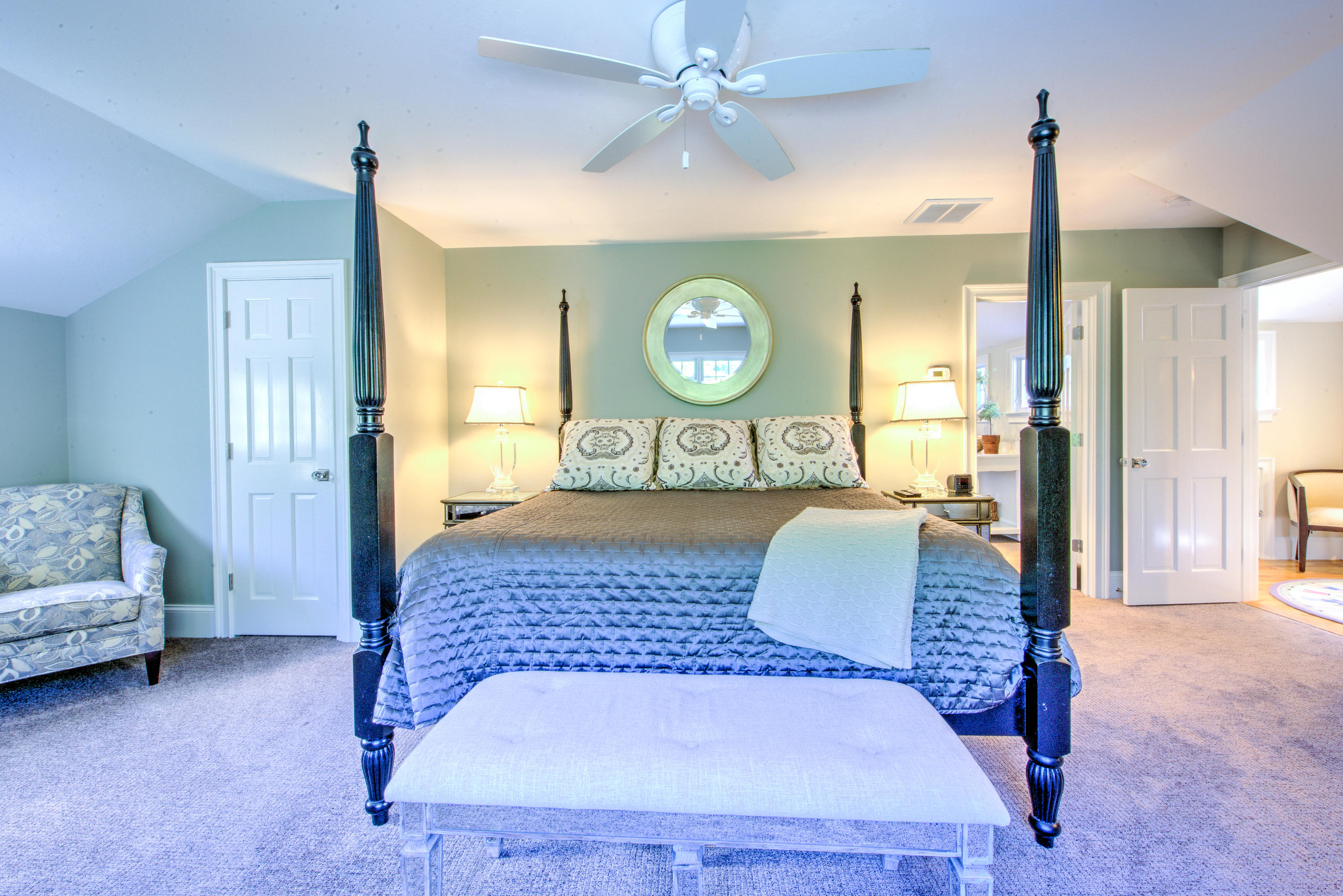 4 Hill Creek Road Centerville, MA 02632 - Photo 21 of 27 a bedroom with a bed and a chandelier