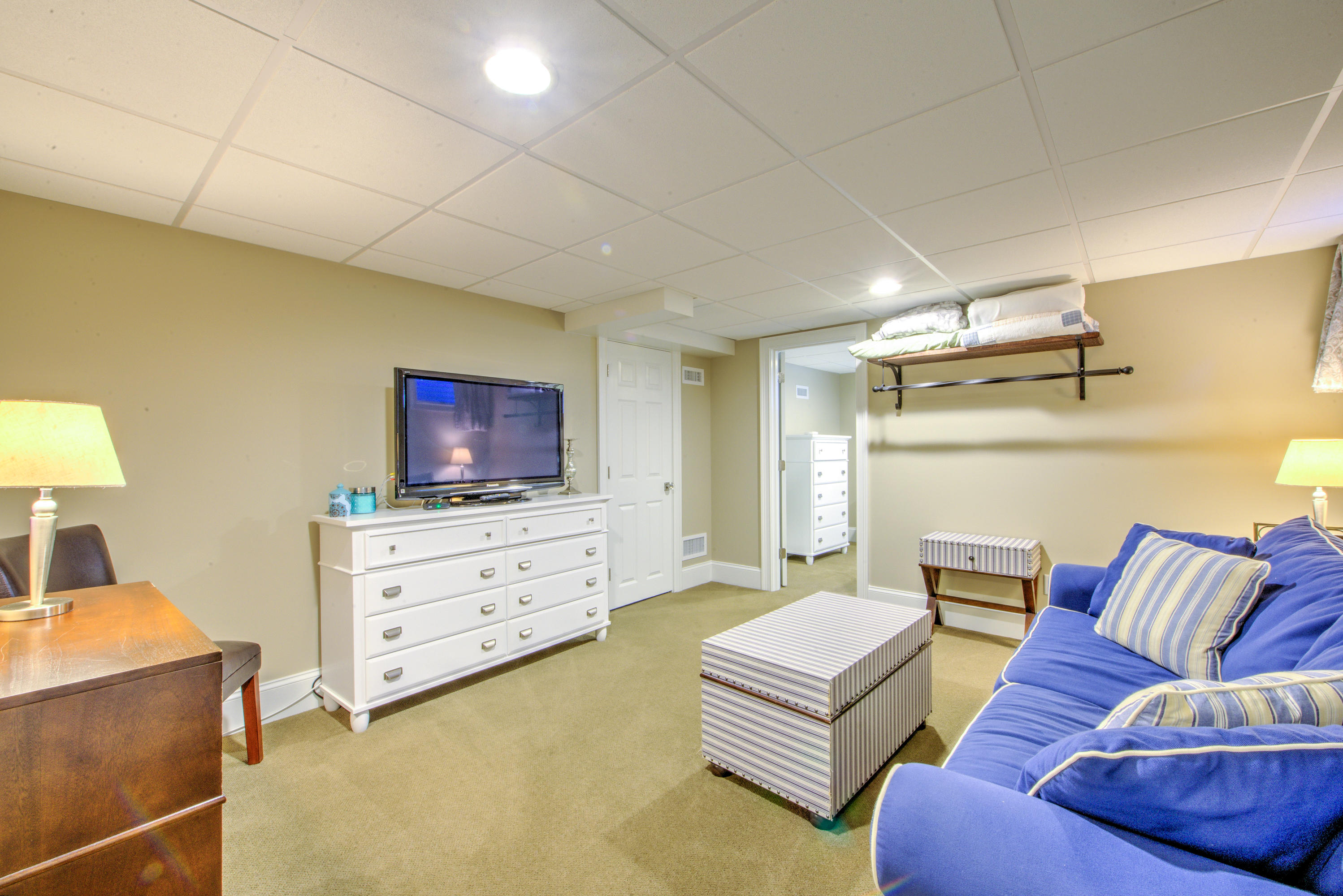 4 Hill Creek Road Centerville, MA 02632 - Photo 24 of 27 a living room with furniture and a flat screen tv