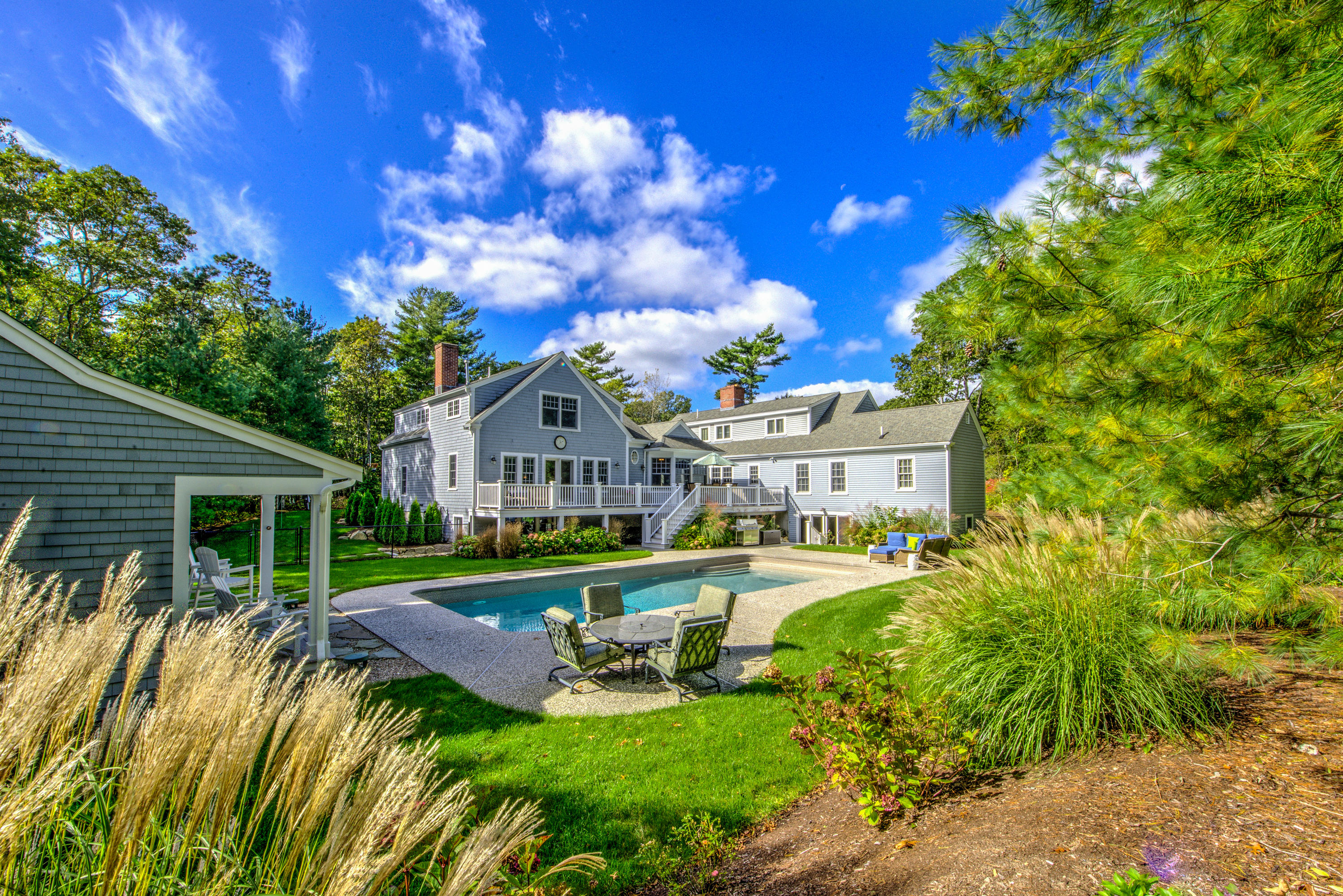 4 Hill Creek Road Centerville, MA 02632 - Photo 27 of 27 a view of house with garden and tall trees