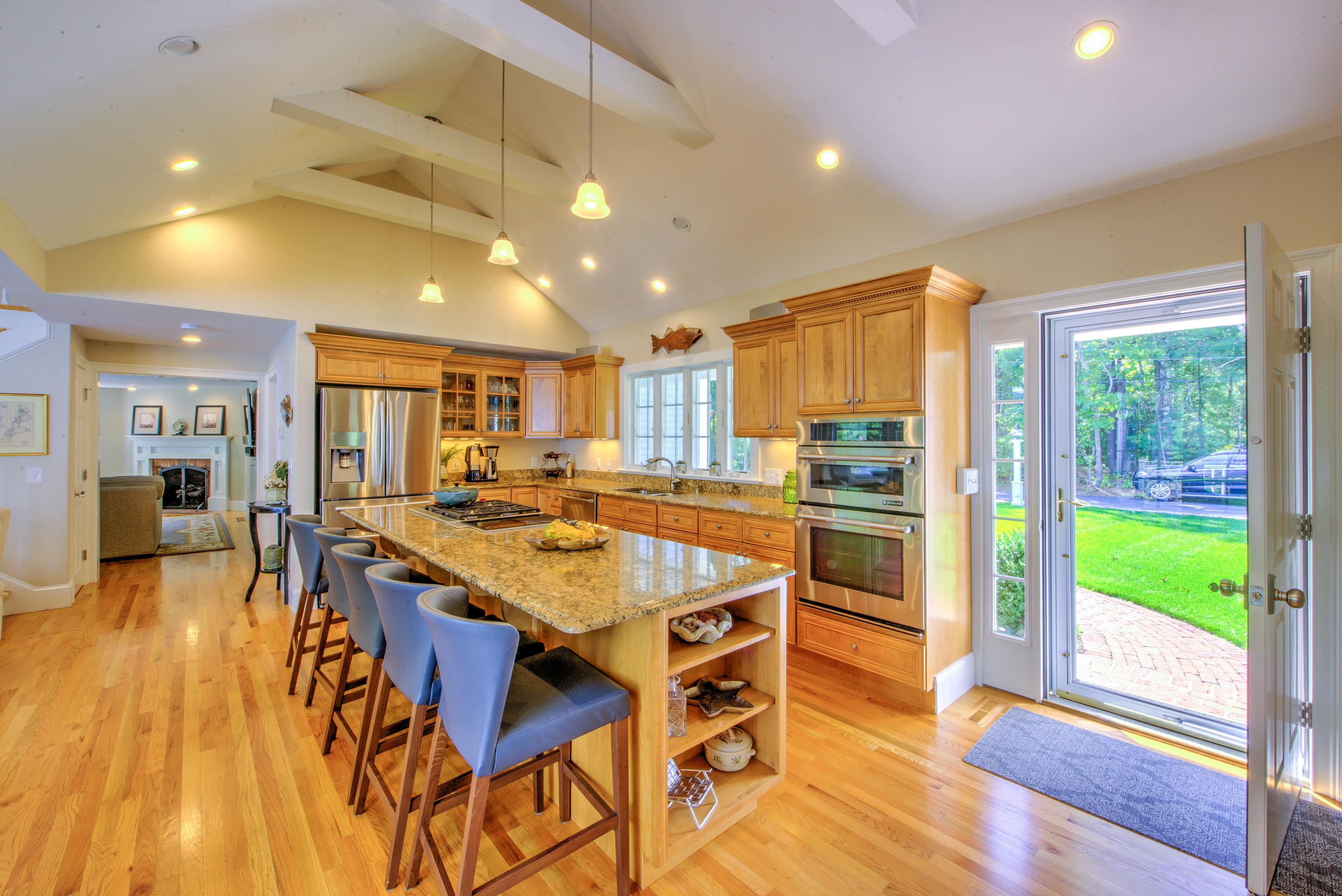 4 Hill Creek Road Centerville, MA 02632 - Photo 3 of 27 a large kitchen with a table and chairs in it