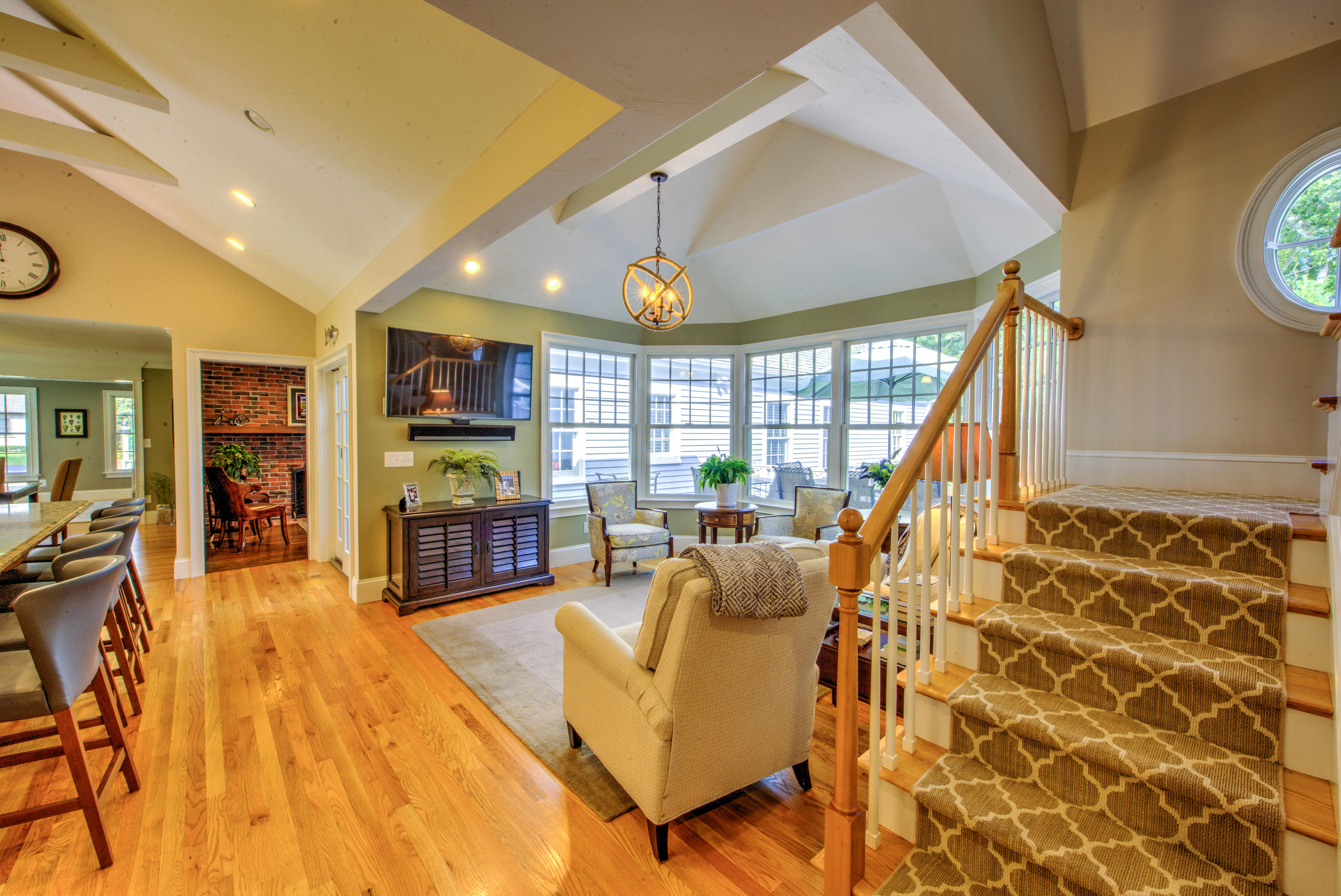 4 Hill Creek Road Centerville, MA 02632 - Photo 5 of 27 a living room with furniture a fireplace and a flat screen tv