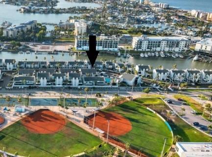 230 Medallion Boulevard, Unit G Madeira Beach, FL 33708 - Photo 4 of 38 a view of a lake with a city
