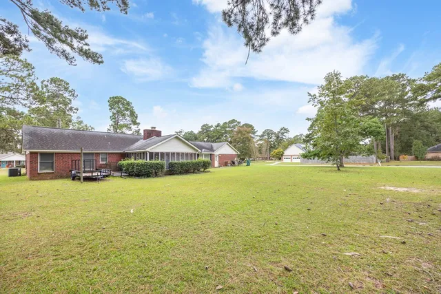 a view of a house with a big yard