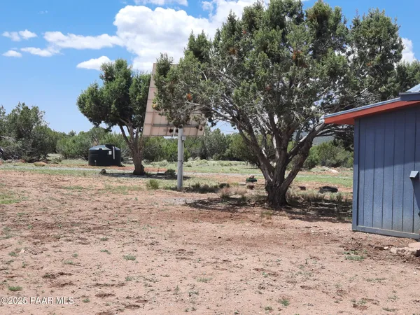 a view of a dry mountains with green space