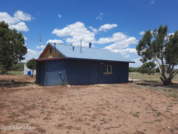 a kitchen with stainless steel appliances a refrigerator sink and cabinets