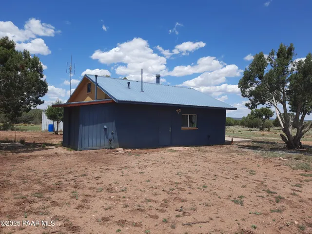 a kitchen with stainless steel appliances a refrigerator sink and cabinets