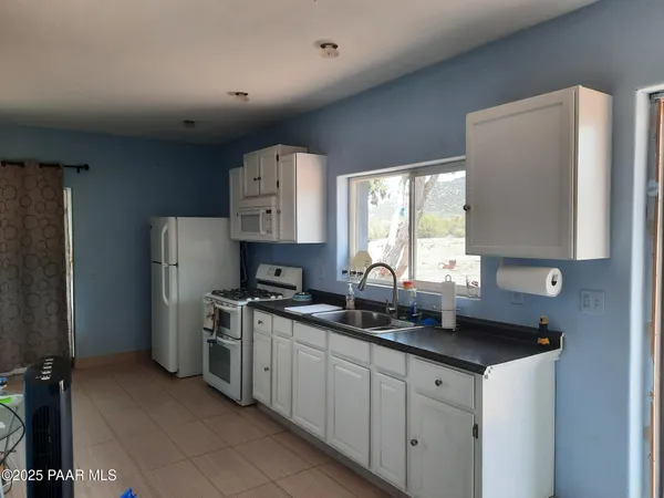 a view of workspace with wooden floor and windows
