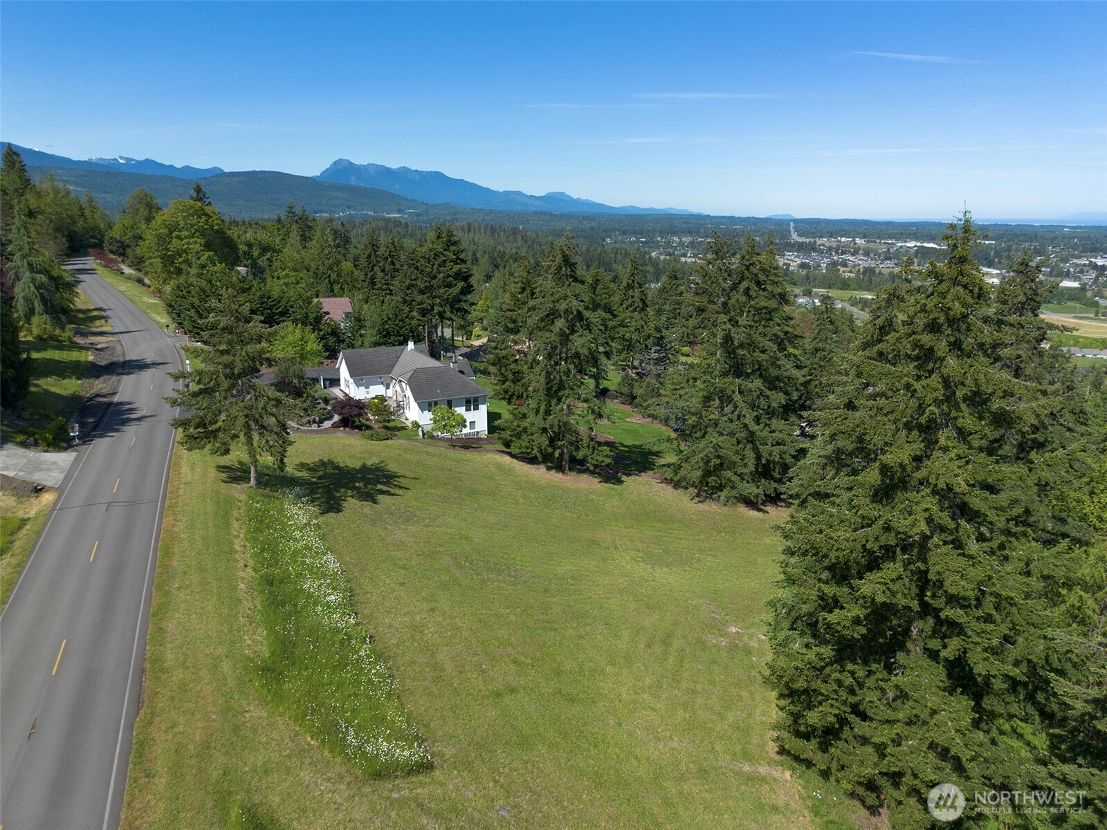 1 Owls Nest Road Sequim, WA 98382 - Photo 5 of 31 a view of a lake in middle of the town