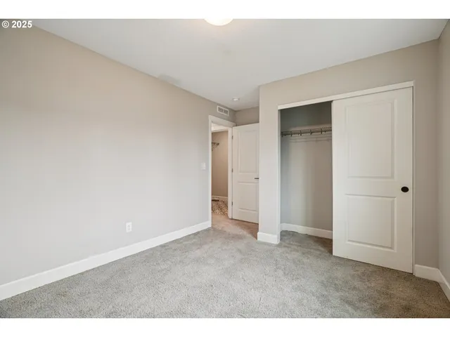 a view of an empty room and entryway