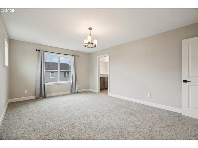 a view of empty room with a fireplace