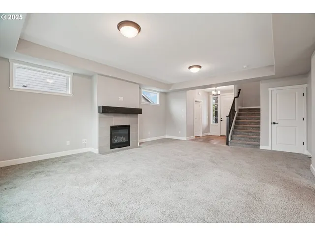 a view of an empty room with a fireplace