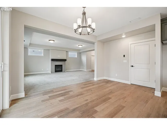 a view of an empty room and fire place