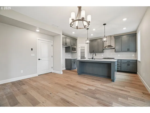 a view of kitchen with wooden floor