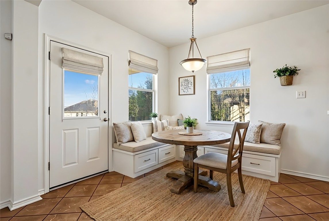 601 Red Hawk Drive Leander, TX 78641 - Photo 15 of 40 Virtually staged - Dining area featuring breakfast area and light tile patterned floors