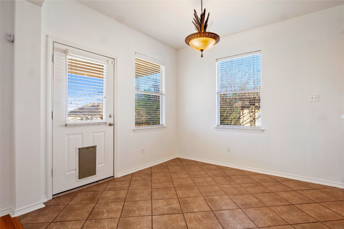 601 Red Hawk Drive Leander, TX 78641 - Photo 16 of 40 Dining area featuring breakfast area and light tile patterned floors