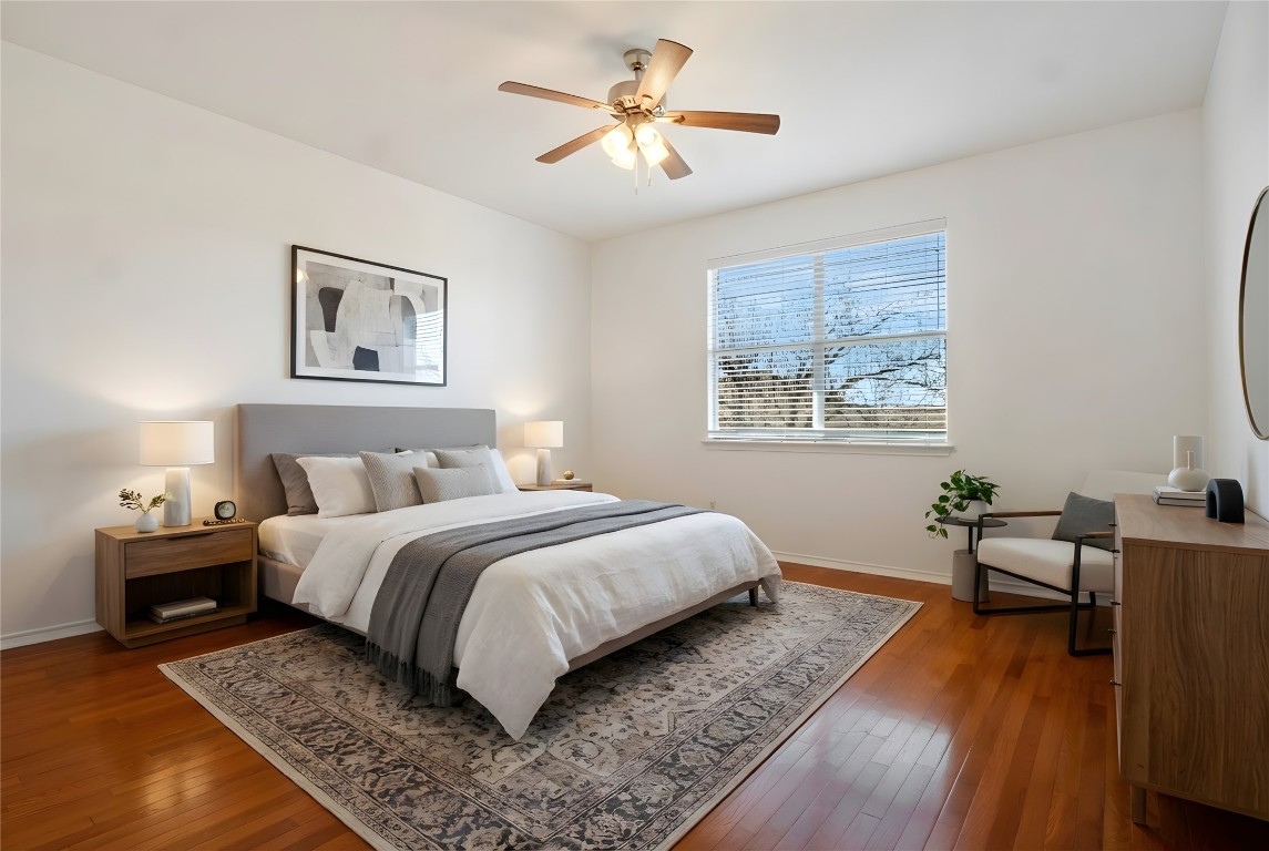 601 Red Hawk Drive Leander, TX 78641 - Photo 17 of 40 Virtually staged - Primary bedroom featuring wood-type flooring and a ceiling fan