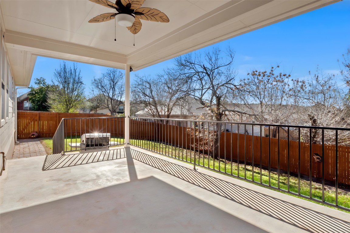 601 Red Hawk Drive Leander, TX 78641 - Photo 24 of 40 Fenced backyard with a ceiling fan, an outdoor hangout area, and a patio area