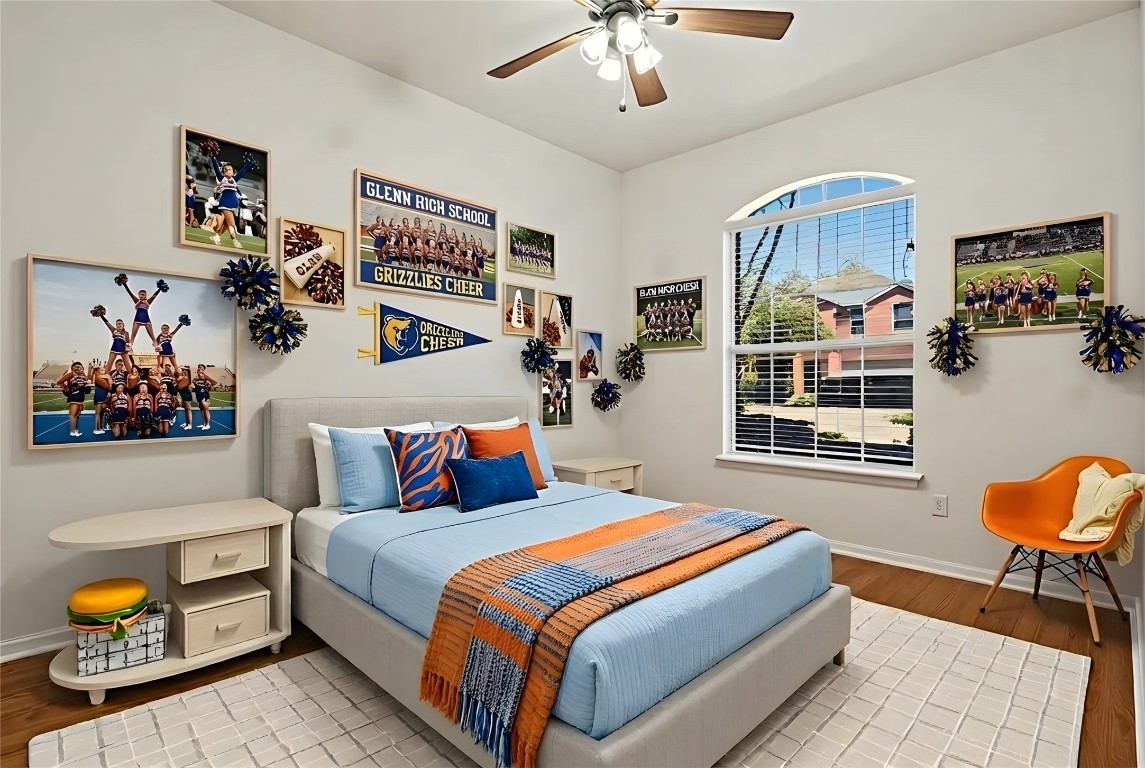 601 Red Hawk Drive Leander, TX 78641 - Photo 27 of 40 Virtually staged - Bedroom #3 with light wood finished floors and ceiling fan