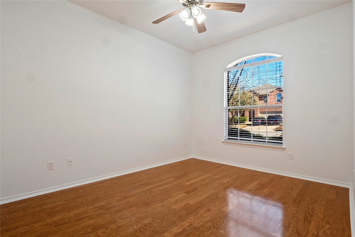 601 Red Hawk Drive Leander, TX 78641 - Photo 28 of 40 Bedroom #3 with light wood finished floors and ceiling fan