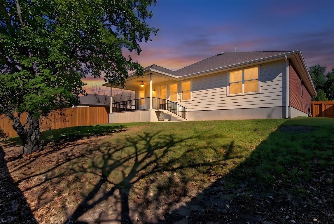601 Red Hawk Drive Leander, TX 78641 - Photo 32 of 40 Back of structure at dusk featuring a patio