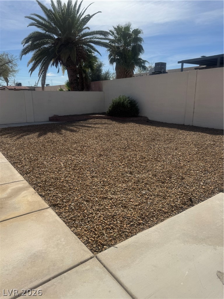 4420 Del Monte Avenue, Unit RENTAL Las Vegas, NV 89102 - Photo 4 of 20 Mature palm trees anchor a low-maintenance landscape, perfect for desert living.