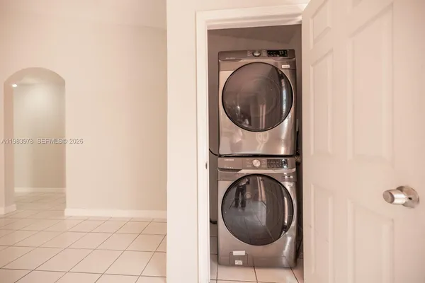 a view of a hallway with washer and dryer