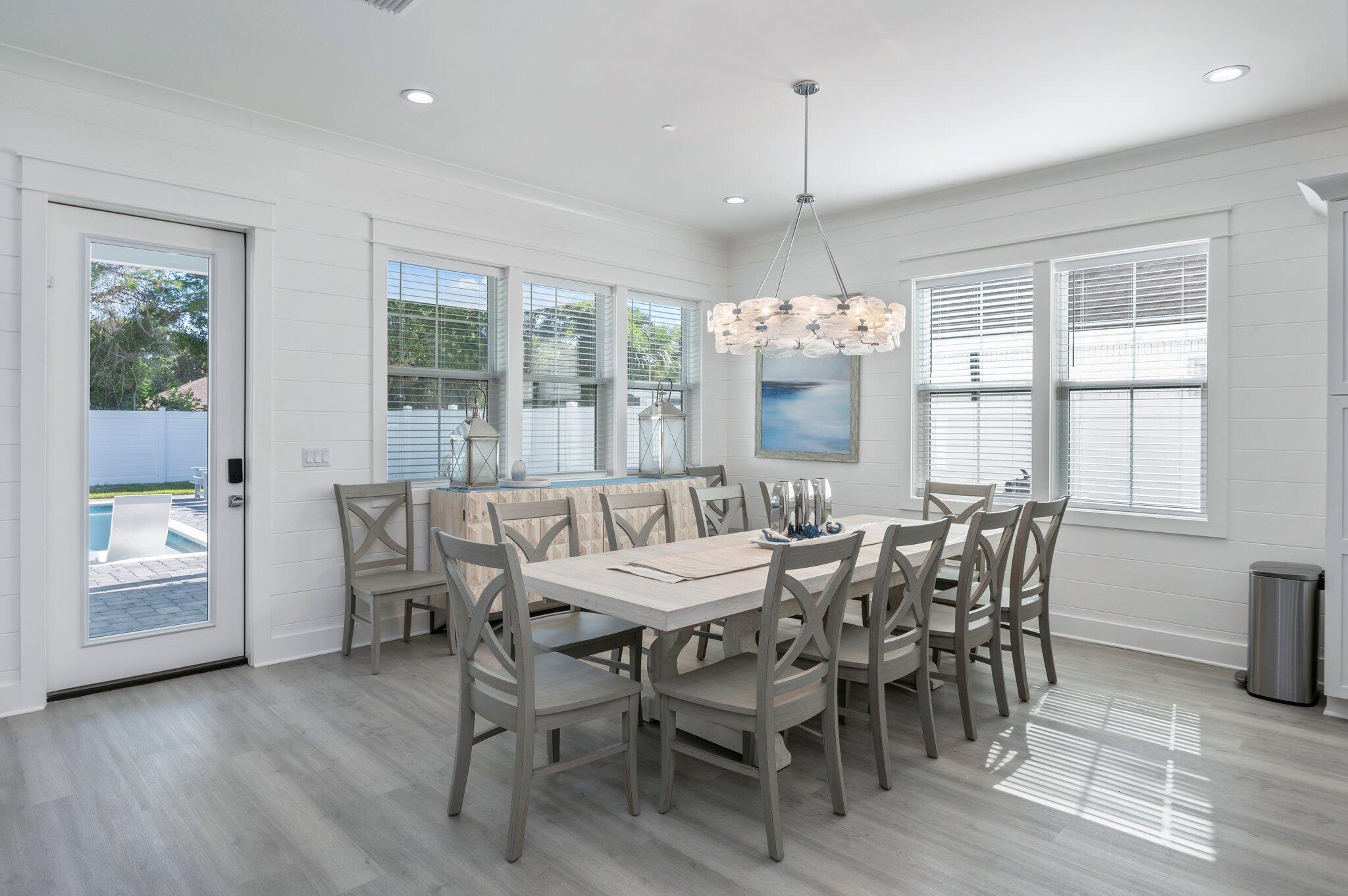 4553 Luke Avenue Destin, FL 32541 - Photo 16 of 70 a dining room with furniture window wooden floor