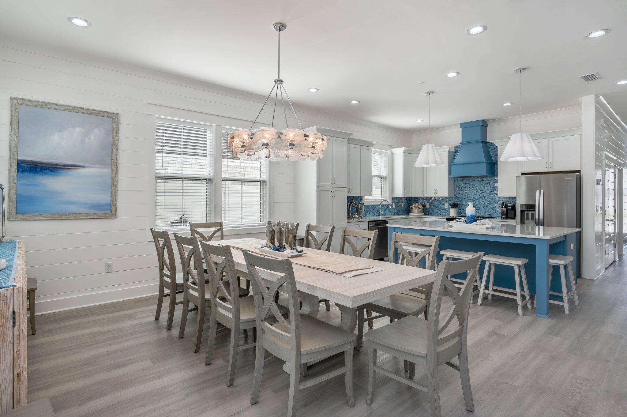 4553 Luke Avenue Destin, FL 32541 - Photo 17 of 70 a view of a dining room with furniture window and wooden floor