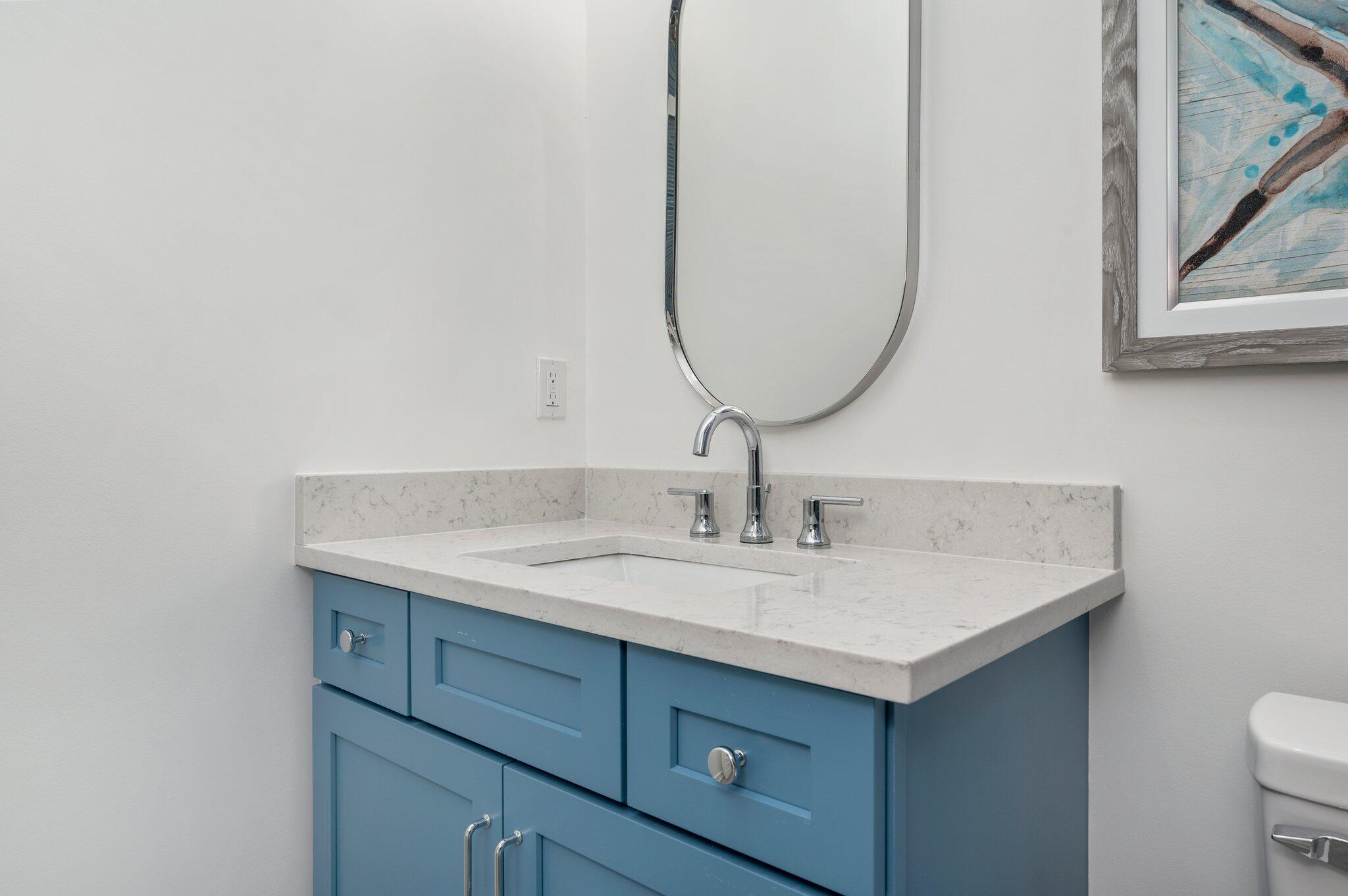4553 Luke Avenue Destin, FL 32541 - Photo 25 of 70 a bathroom with a sink and a mirror
