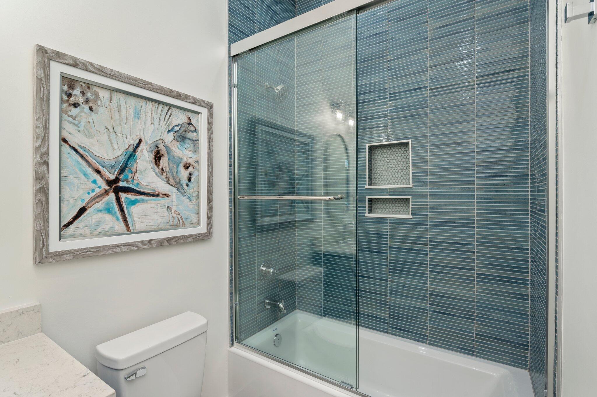 4553 Luke Avenue Destin, FL 32541 - Photo 26 of 70 a bathroom with a shower a toilet and a bathtub