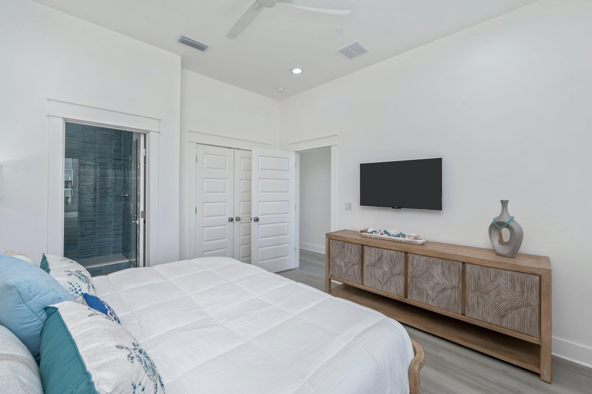 4553 Luke Avenue Destin, FL 32541 - Photo 28 of 70 a bedroom with a bed and a flat screen tv