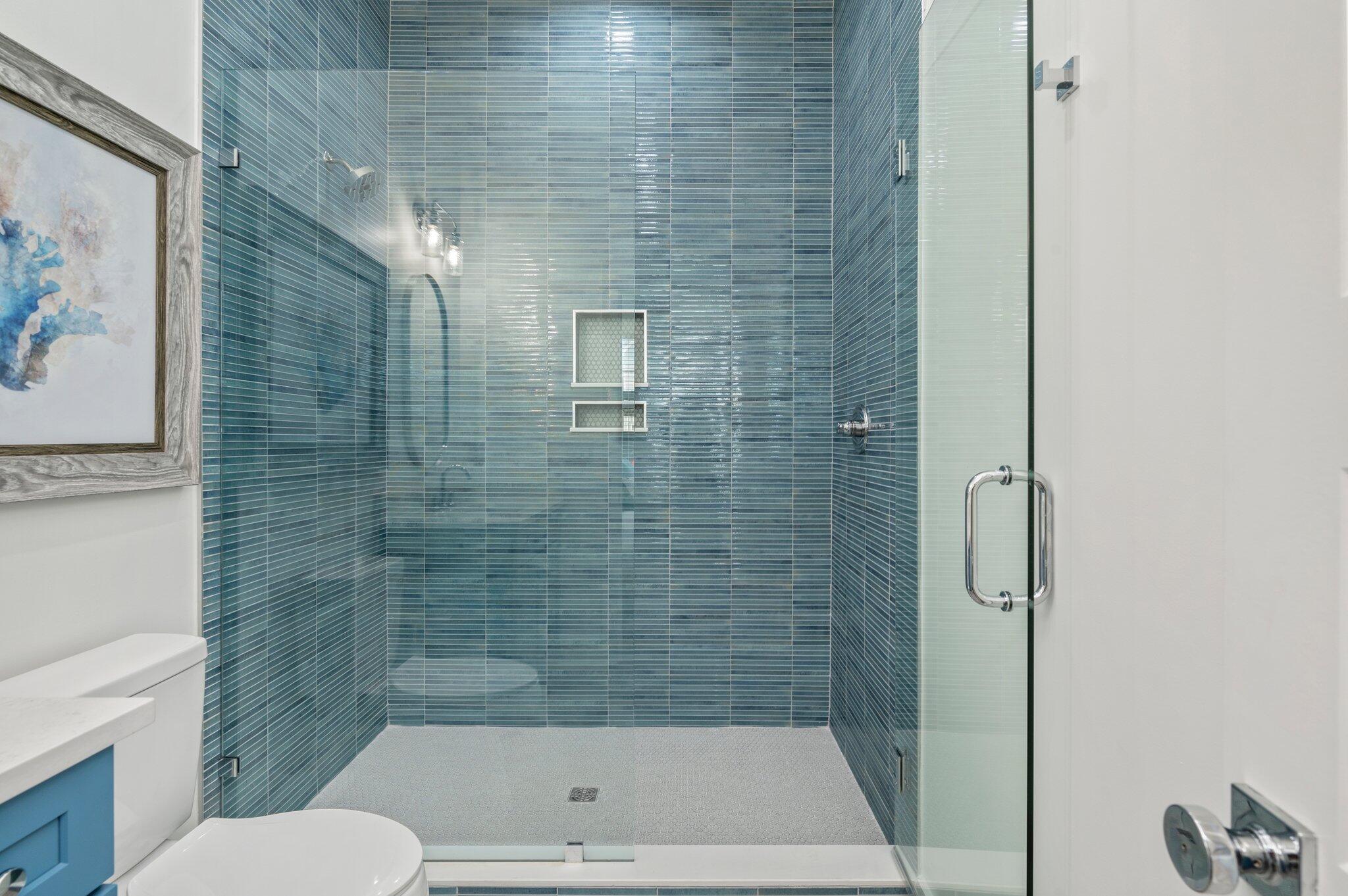 4553 Luke Avenue Destin, FL 32541 - Photo 31 of 70 a bathroom with a shower and a toilet