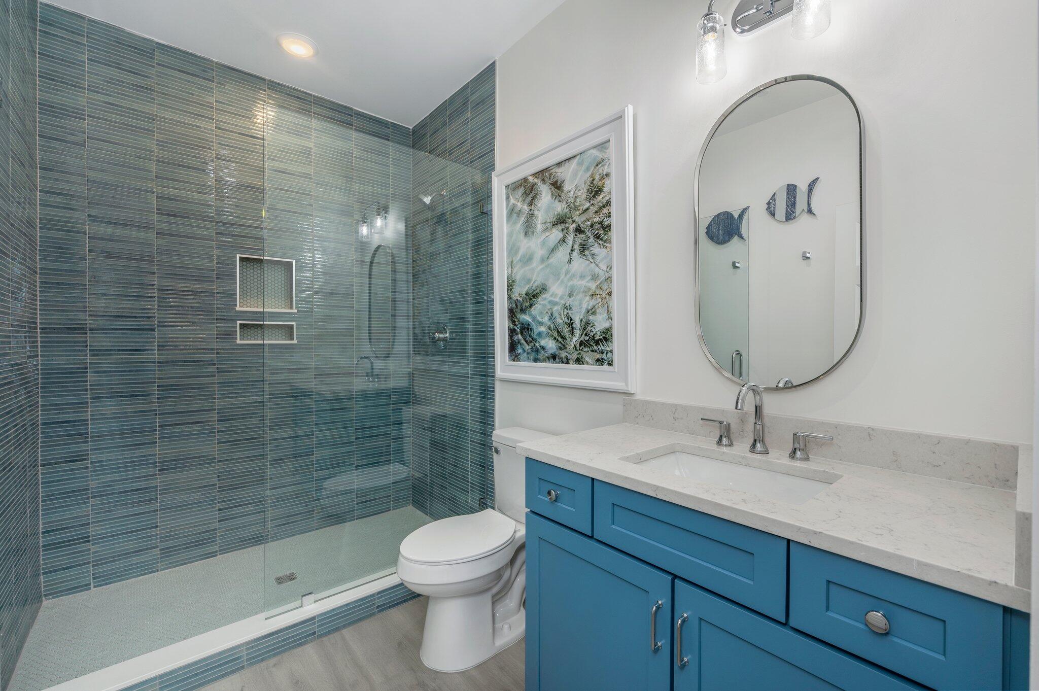 4553 Luke Avenue Destin, FL 32541 - Photo 50 of 70 a bathroom with a sink a toilet and shower