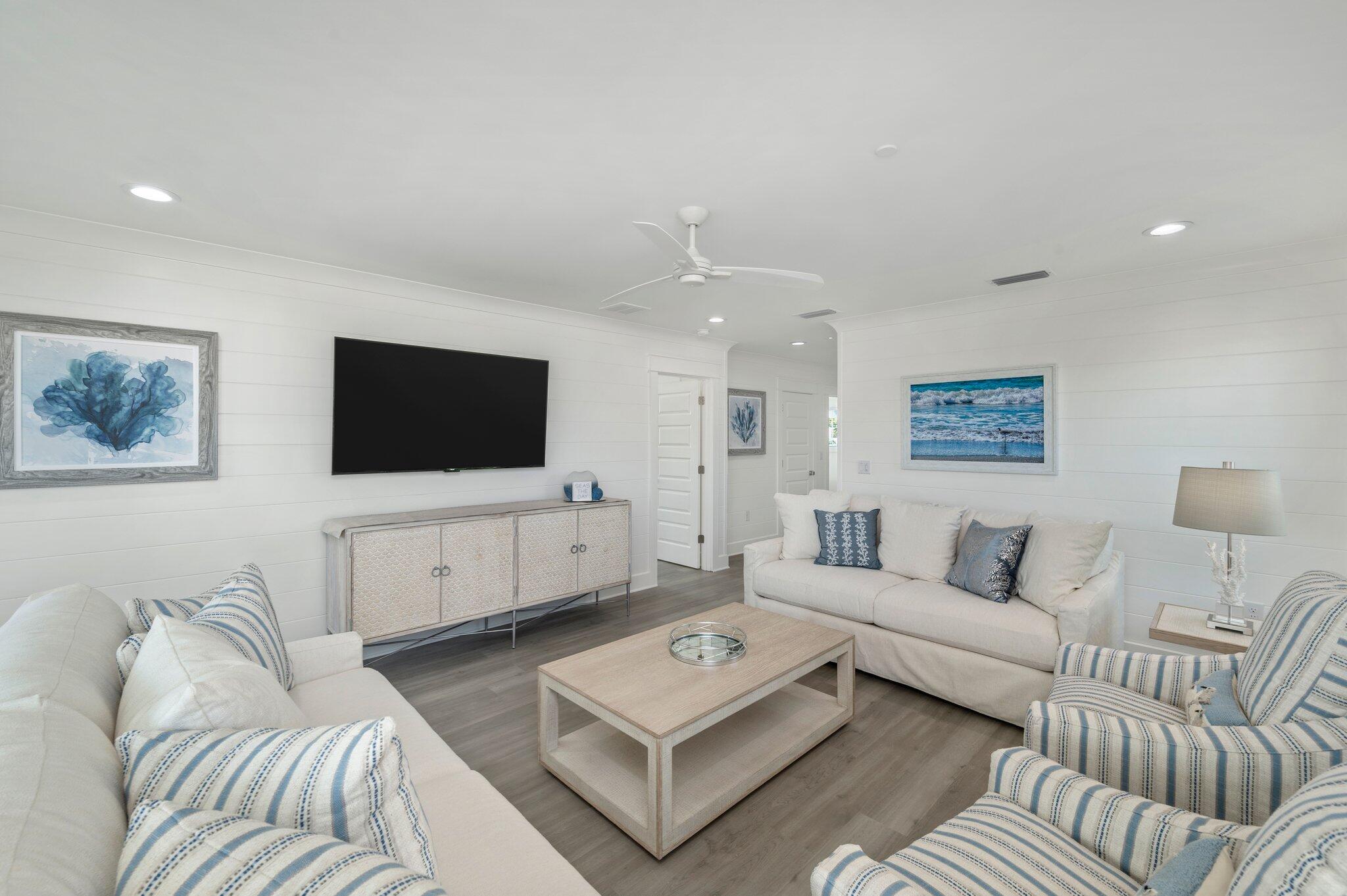 4553 Luke Avenue Destin, FL 32541 - Photo 55 of 70 a living room with furniture and a flat screen tv