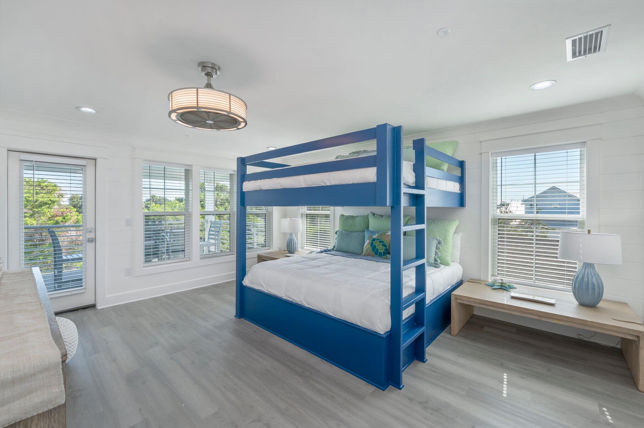 4553 Luke Avenue Destin, FL 32541 - Photo 56 of 70 a bedroom with a large bed and a large window