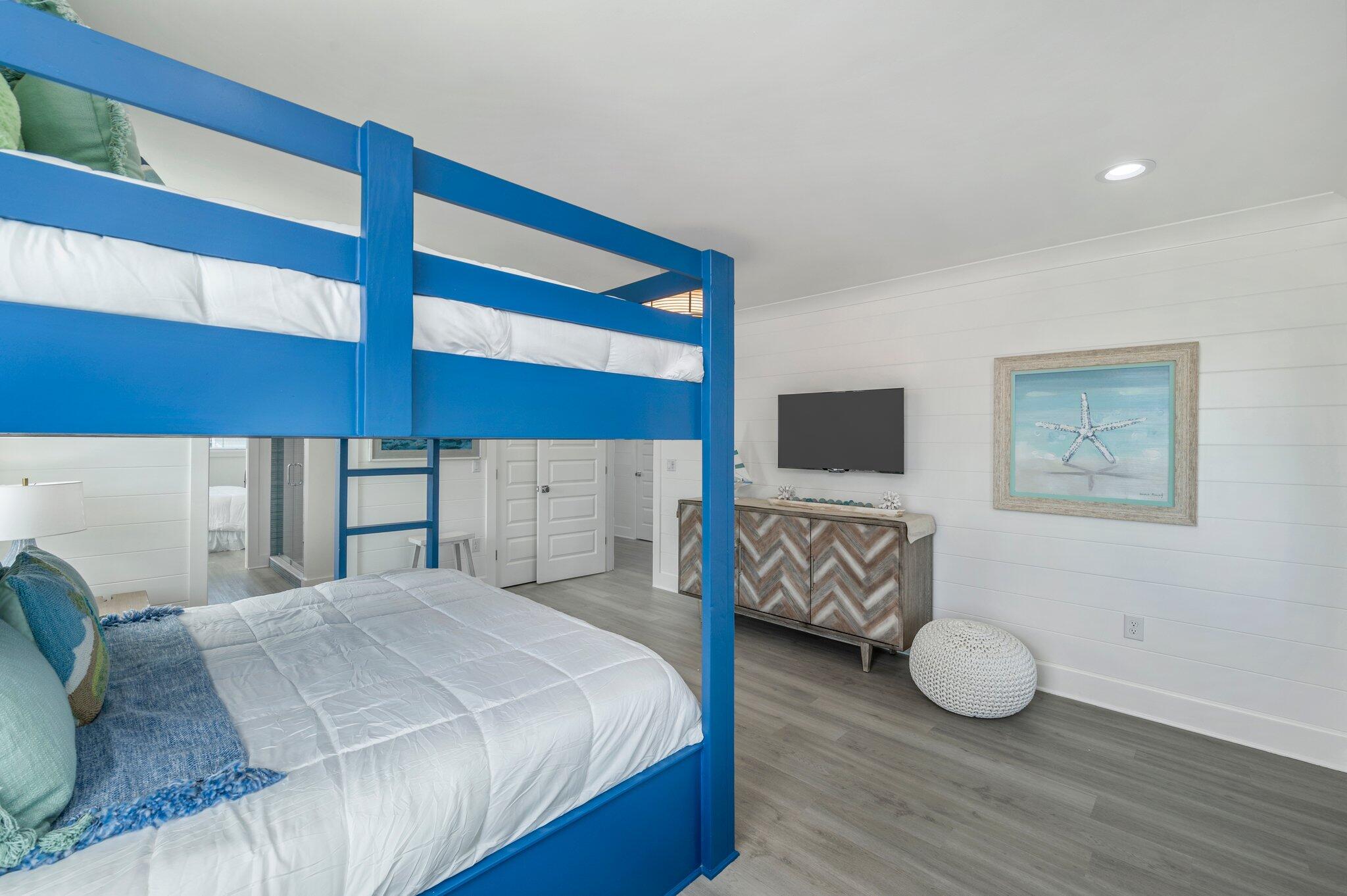4553 Luke Avenue Destin, FL 32541 - Photo 58 of 70 a bedroom with a bed and flat screen tv