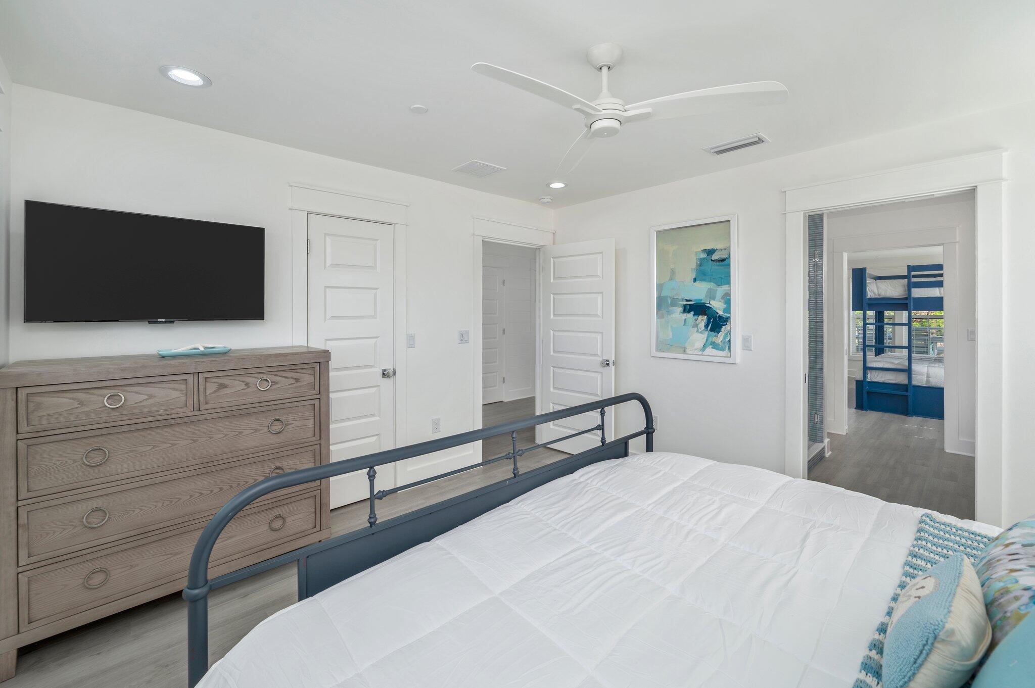 4553 Luke Avenue Destin, FL 32541 - Photo 61 of 70 a bedroom with a bed and a flat screen tv