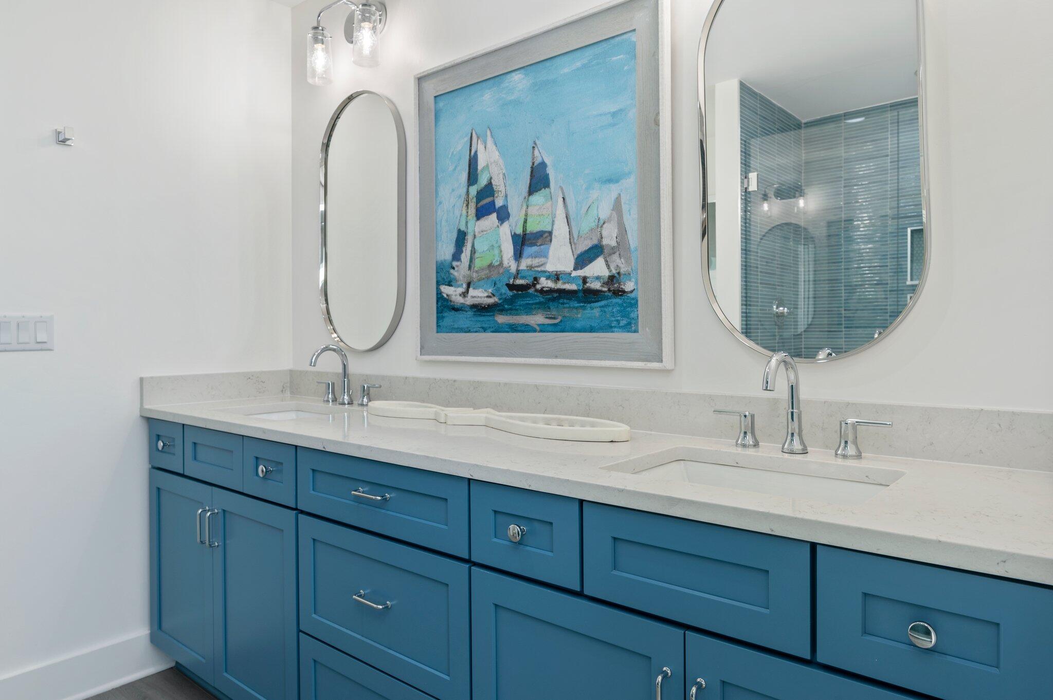 4553 Luke Avenue Destin, FL 32541 - Photo 62 of 70 a bathroom with double vanity sinks and a mirror